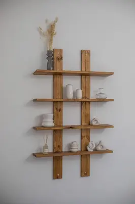 a wooden shelf hanging on a wall with dishes at Zàia Suites & Living, Suite N2, pool view in Gennadi