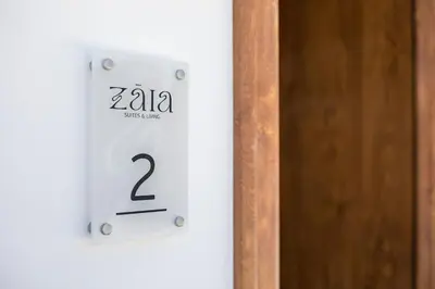 a lightswitch with the number on it next to a door at Zàia Suites & Living, Suite N2, pool view in Gennadi