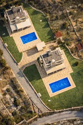 an overhead view of a house with three swimming pools at Kalithea Sunrise in Rhodes Town