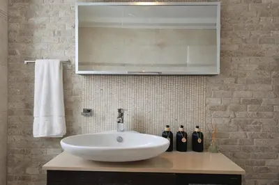 a bathroom with a white sink and a mirror at Alkion in Asgourou