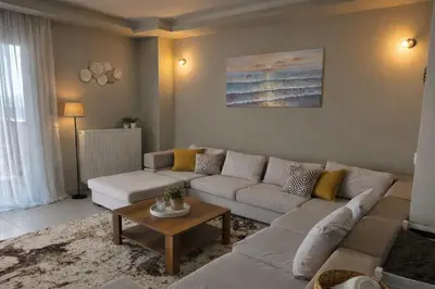 a living room with a couch and a table at Alkion in Asgourou