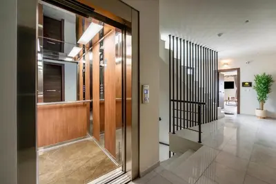 a hallway with sliding glass doors in a building at SunHall City Maisonette in Rhodes Town