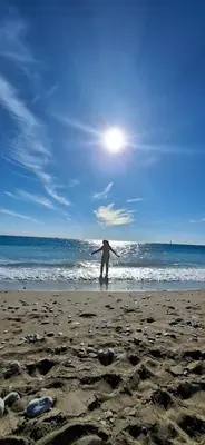 a person standing on a beach with the ocean at Sea-Nature-Wellness in Kolimbia