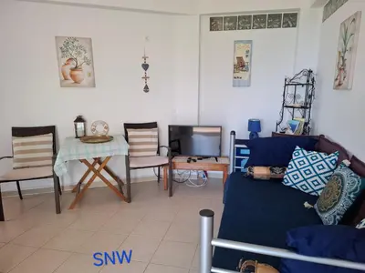 a living room with a couch and a table at Sea-Nature-Wellness in Kolimbia