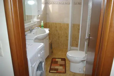 a bathroom with a sink and a toilet and a shower at Mano's House in Monólithos