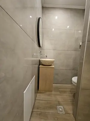 a bathroom with a sink and a toilet at Casa Blue Sarantis in Faliraki