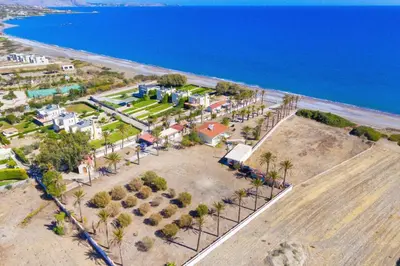 an aerial view of a resort next to the ocean at Villa Maria Beachfront Residence in Kiotari