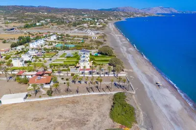 an aerial view of a beach and the ocean at Villa Maria Beachfront Residence in Kiotari