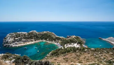 an aerial view of a small island in the ocean at Faliraki Dream Studios & Apartments in Faliraki