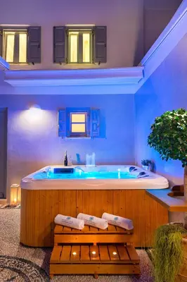 a large bathroom with a tub in a room at Lindos Shore Summer House with Jacuzzi and sea view !!! in Líndos