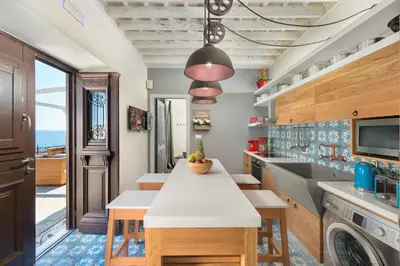 a kitchen with a counter and a sink and a dishwasher at Lindos Vigli Private Villa in Líndos