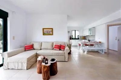 a living room with a couch and a table at Villa Akti in Lachania
