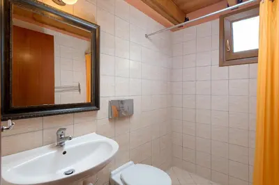 a bathroom with a sink and a toilet at Villa Lahania in Lachania