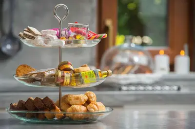 two tiered plates of bread and pastries on a counter at Katerina Boutique Villa in Rhodes Town