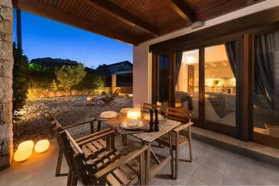 a dining table with candles on a patio at Katerina Boutique Villa in Rhodes Town
