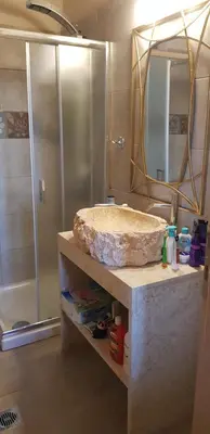 a bathroom with a marble sink and a shower at Villa Sealine in Pefki Rhodes