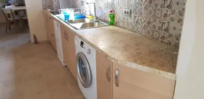 a kitchen with a sink and a washing machine at Villa Sealine in Pefki Rhodes