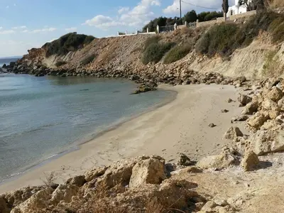 a beach with rocks and the ocean on a hill at Villa Sealine in Pefki Rhodes