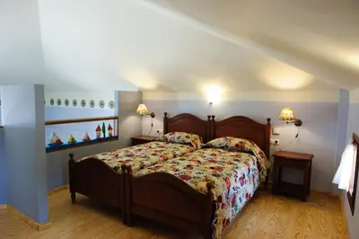 a bedroom with a large bed in a room at Alisahni Beachfront Villas in Kiotari