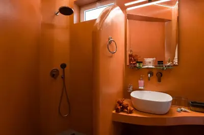 a bathroom with a sink and a mirror at Chrysanthi Studios in Líndos
