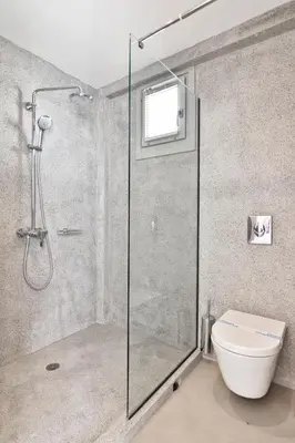 a bathroom with a shower and a toilet at Lindos Comfy Suites in Líndos