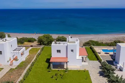 an aerial view of a white house and the ocean at Villa Sevil in Lachania