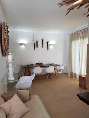 a living room with a table and chairs at Villa Sevil in Lachania