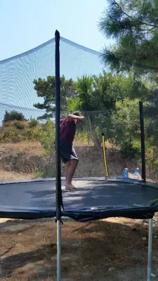 a person standing on top of a trampoline at Alexandra Homestay in Kalavárda