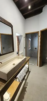 a bathroom with a large tub and a mirror at Villa Aphrodite Lindos Suites in Líndos