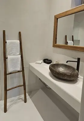 a bathroom with a sink and a mirror at Villa Aphrodite Lindos Suites in Líndos