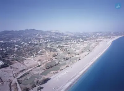 an aerial view of a beach and the ocean at Ktima Ellopia in Kolimbia