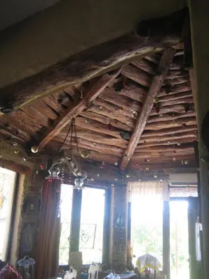 a room with a wooden ceiling with windows at Ktima Ellopia in Kolimbia