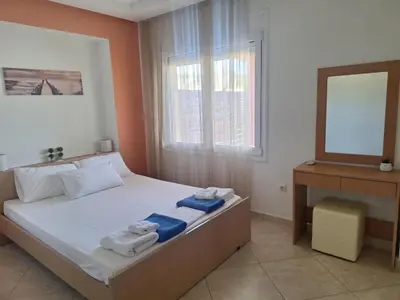 a bedroom with a bed with towels on it at villa de calme in Pastida