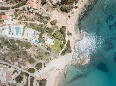 an aerial view of a beach and the ocean at Plakia Beach Apartments in Pefki Rhodes