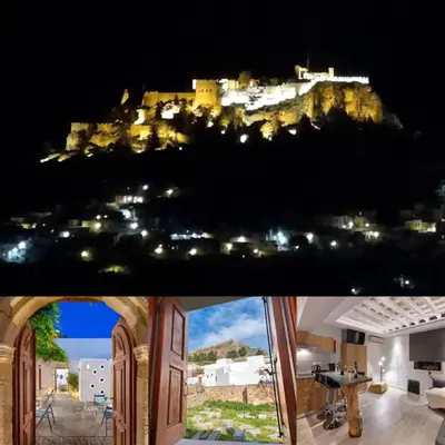 a view of the amalfi coast at night at Lindos Citrin Studios in Líndos