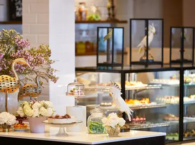 a buffet with desserts and pastries on a table at Grecotel LUXME Dama Dama in Faliraki
