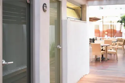 an open door to a dining room with a table at Athena Hotel in Rhodes Town