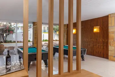a pool room with a pool table in a house at Athena Hotel in Rhodes Town