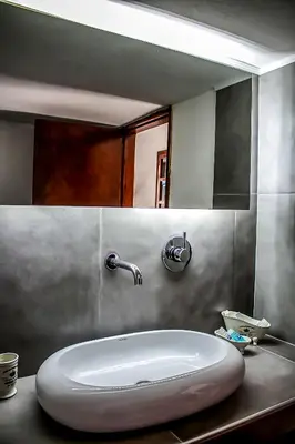 a bathroom sink with a large white oval sink at CasaLindos Spitaki in Líndos