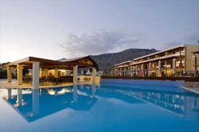 a large pool of blue water in front of a hotel at Island Blue Hotel in Pefki Rhodes