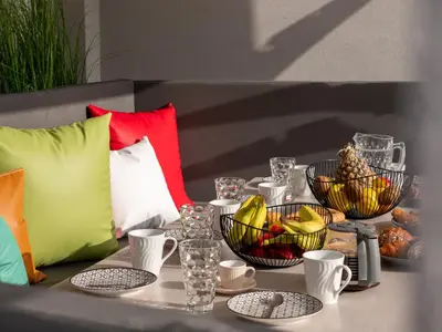 a table topped with bowls of fruit and other foods at Villa Stergos in Kremasti