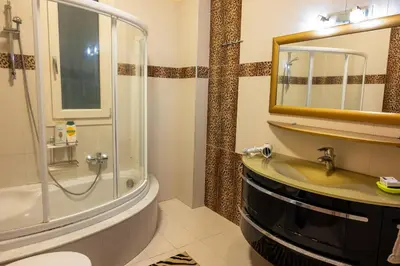 a bathroom with a shower and a sink at Villa Stergos in Kremasti