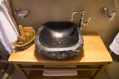 a black sink on a wooden table in a bathroom at Villa dei Ciottoli in Rhodes Town