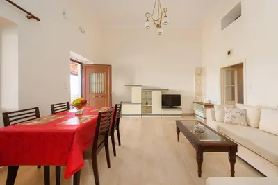 a living room with a table and a couch at Theologos Traditional House in Theologos