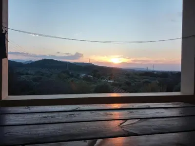 a window with a view of the sunset at Theologos Traditional House in Theologos