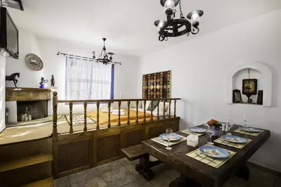 a room with a bed and a table with plates on it at Villa Elias in Archangelos