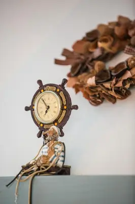 a clock sitting on top of a table at Villa Elias in Archangelos