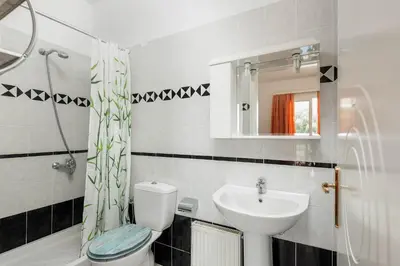 a bathroom with a toilet and a sink at Sutherlea in Koskinou