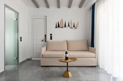 a living room with a couch and a table at Lindos Nest in Pefki Rhodes