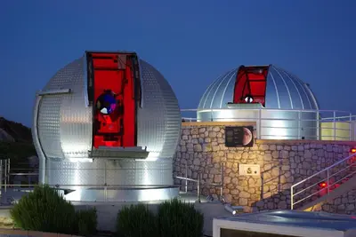 a building with two domes on top of it at Astronomy Studios in Faliraki